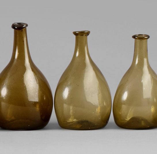 An Exceptional Set of 13 Graduated Blown Chestnut Bottles